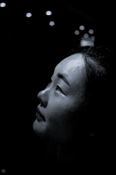 Close-up of a thoughtful businesswoman with soft lighting emphasizing her professional poise and clarity