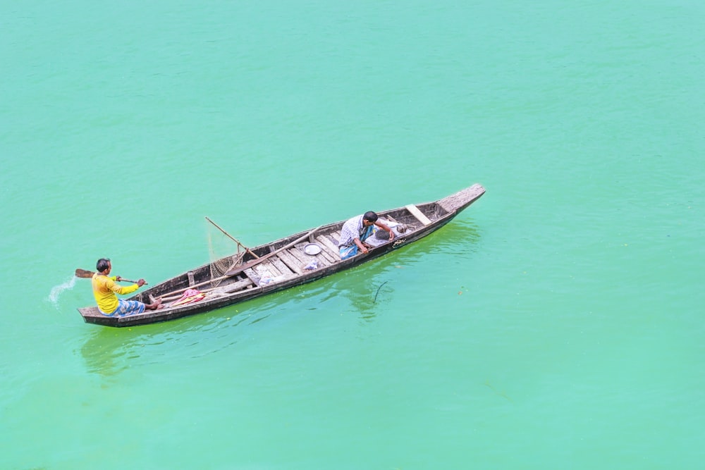 men on canoe