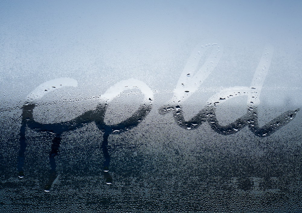 the word cold written on a frosty window