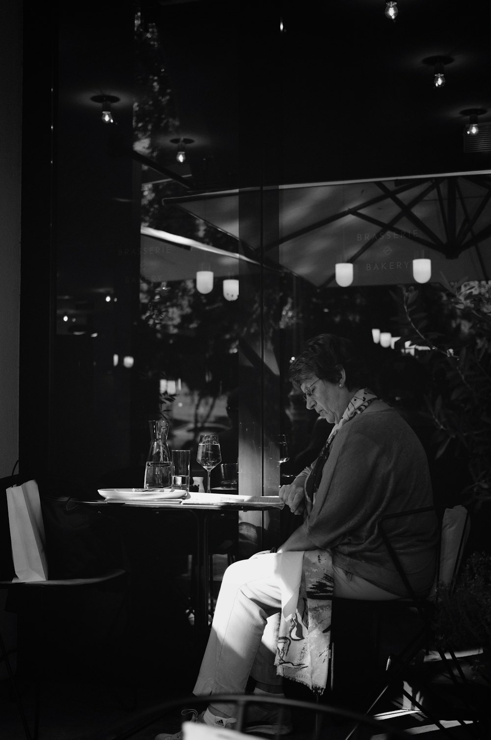 man sitting on chair with table