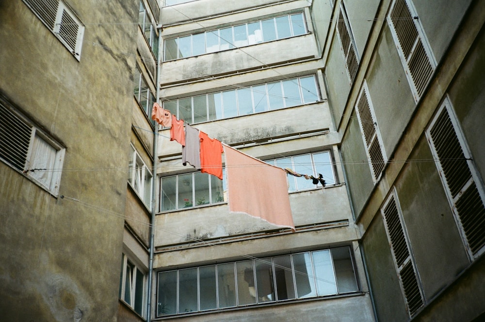 a clothesline hanging from a clothes line in front of a building