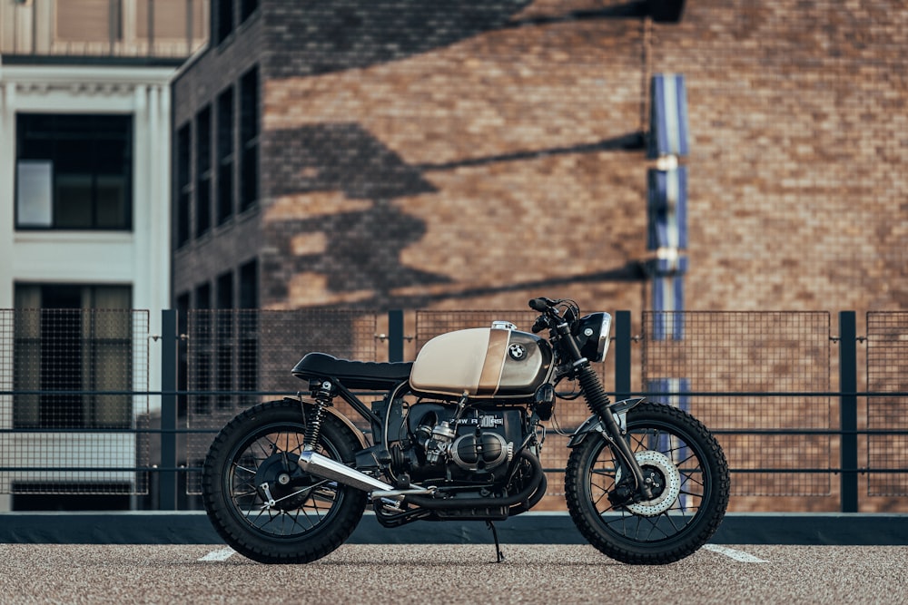 cruiser motorcycle parked on concrete floor near railing