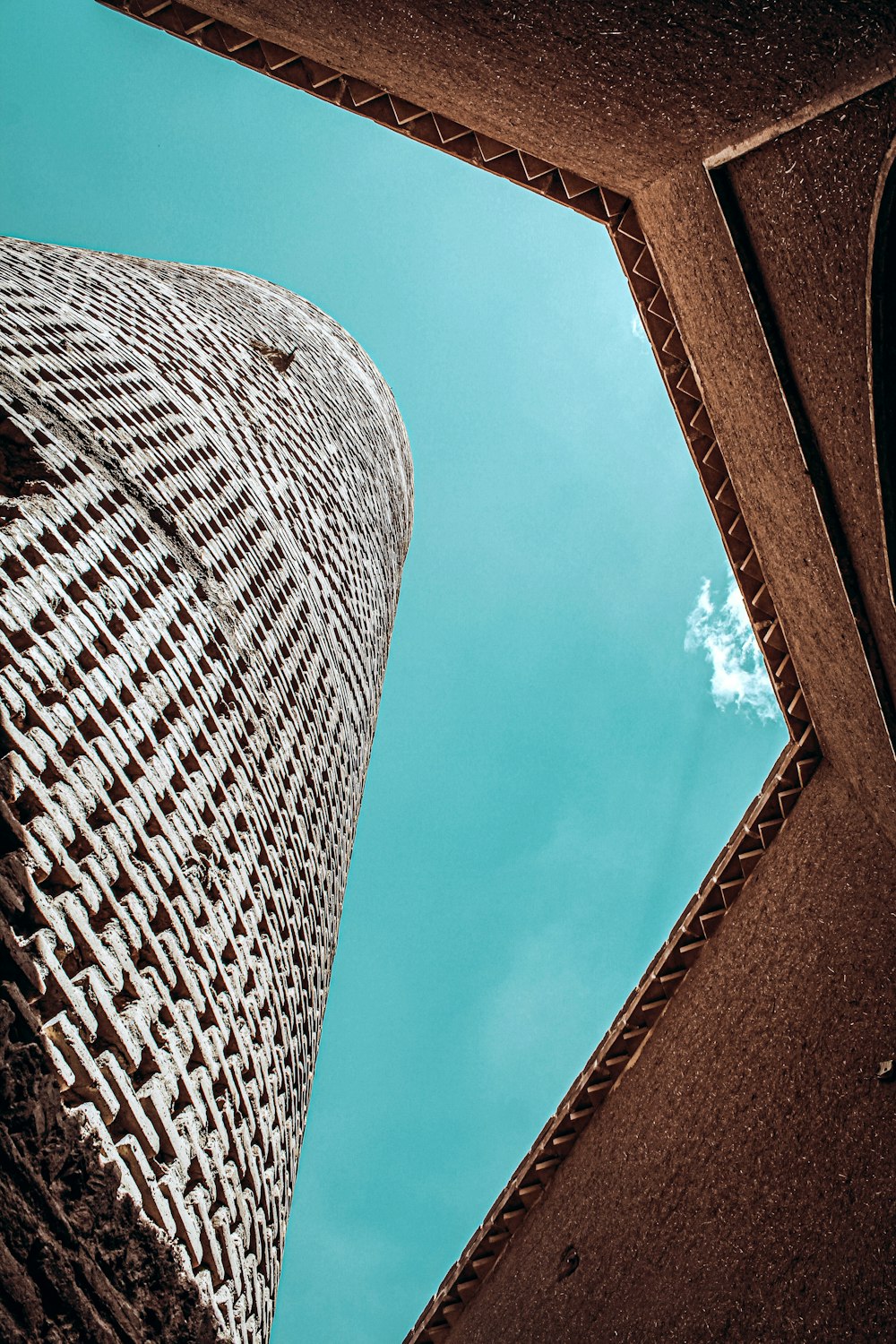 a tall building with a sky in the background