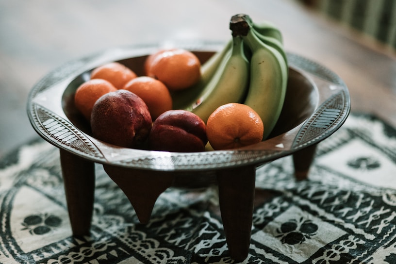 Handcrafted fruit-shaped wooden bowls on a rustic table