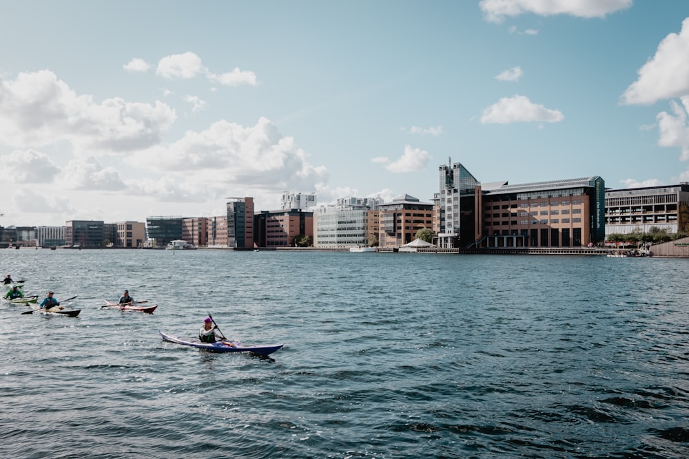 people riding kayak during daytime