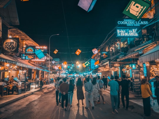 people walking in the street at night time in Siem Reap Cambodia