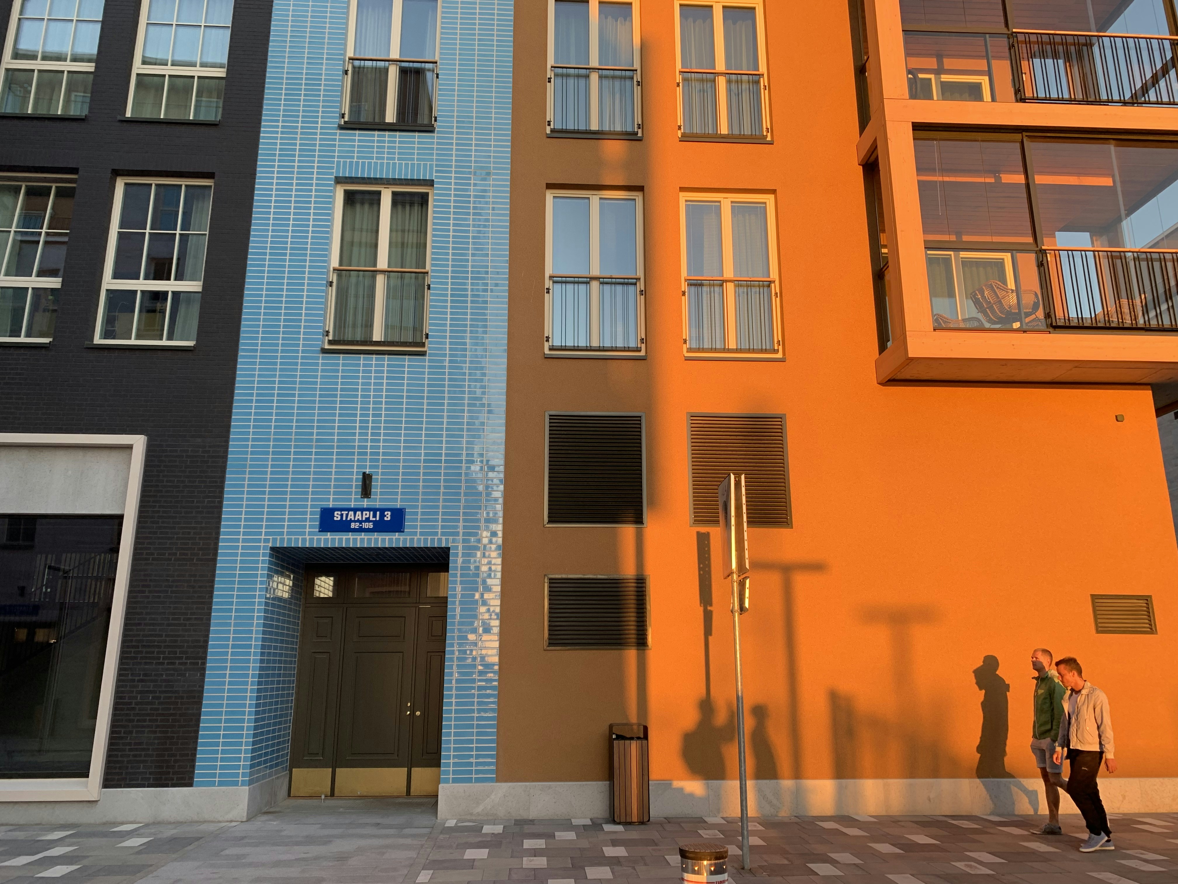 two men walking on sidewalk at daytime, 