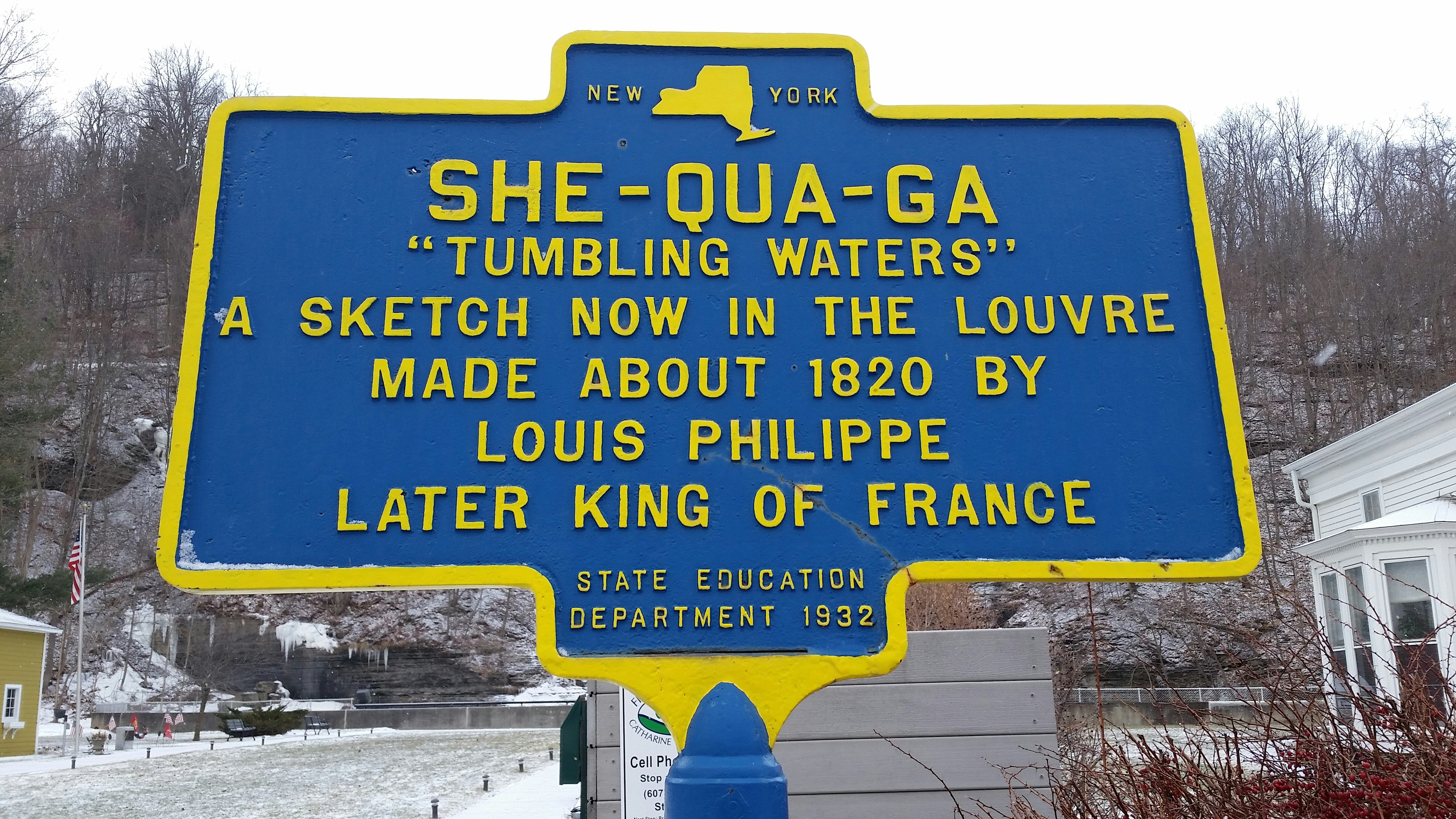 a blue and yellow sign in front of a building