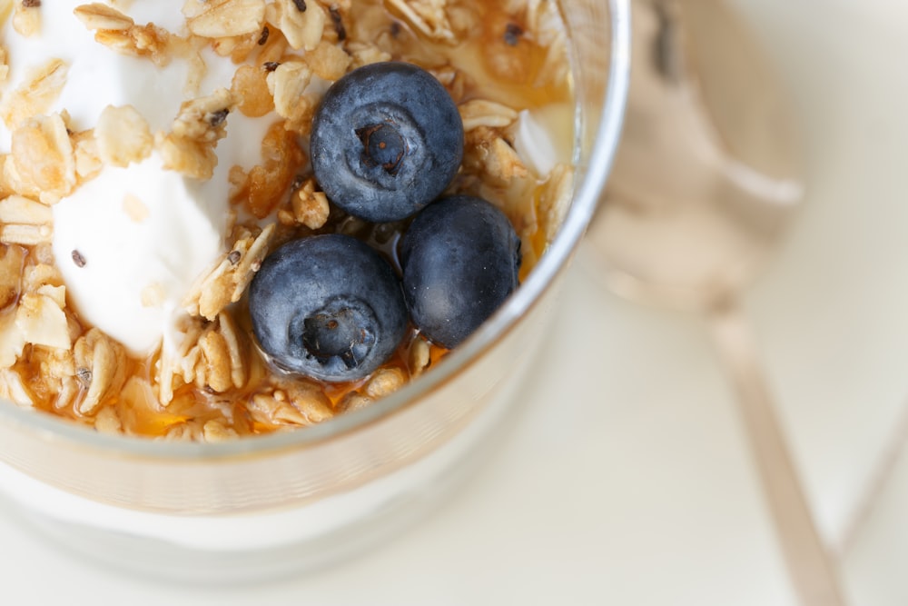 blue berry on clear glass bowl