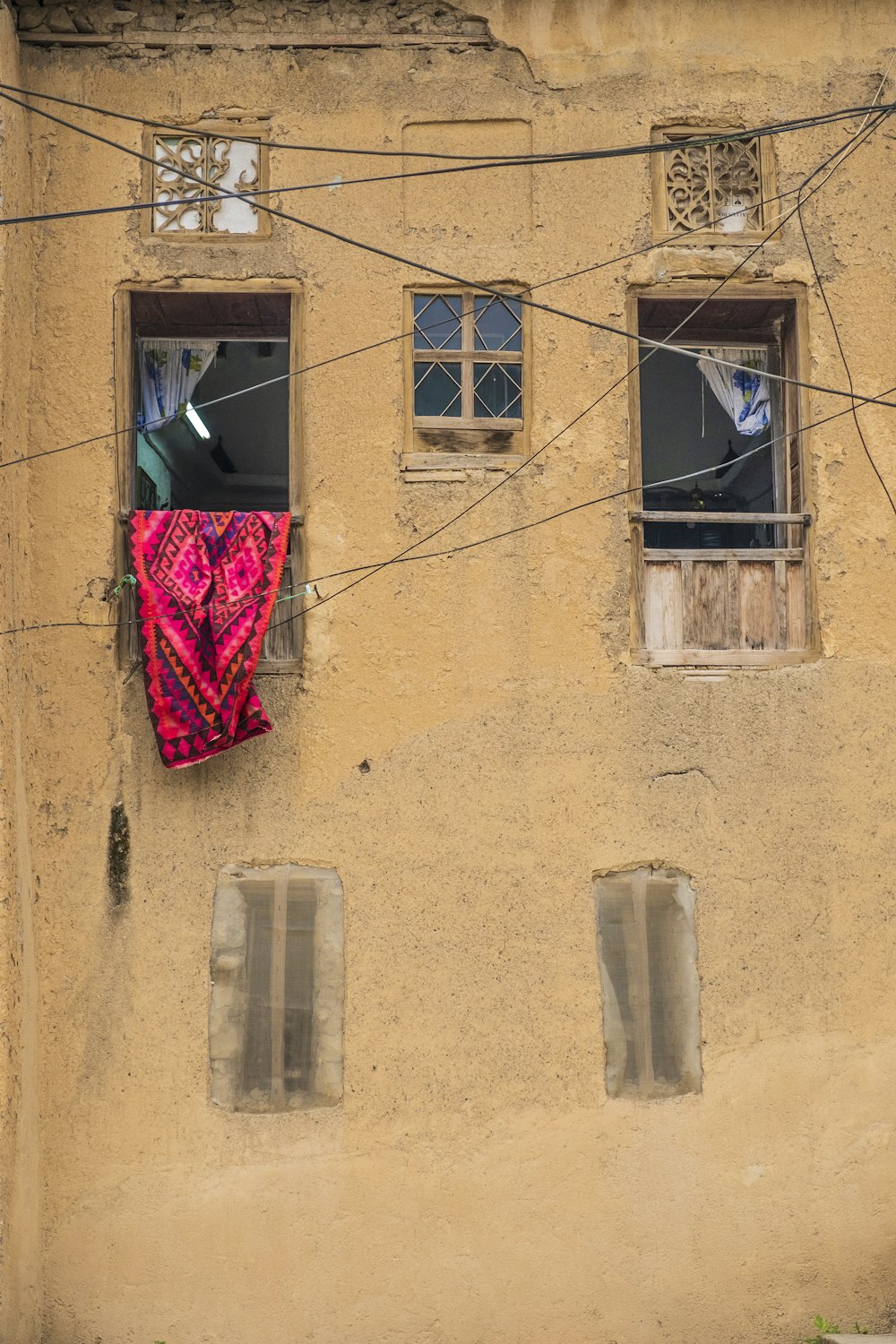 red cloth hanging on window