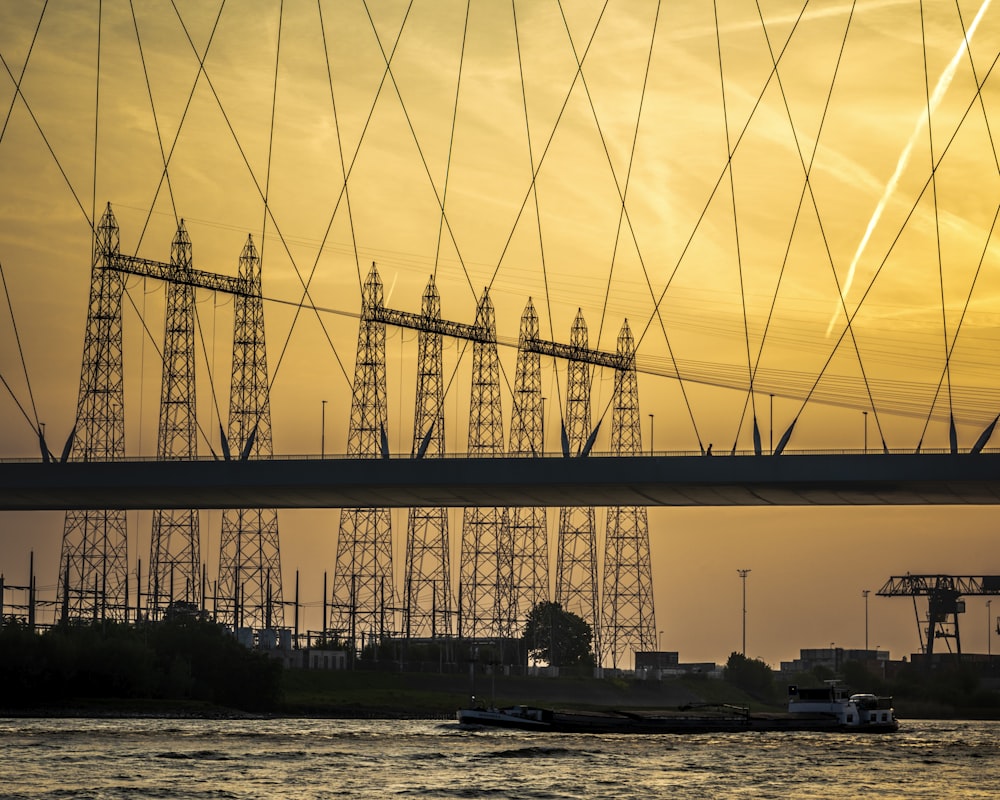 silhouette of bridge during daytime