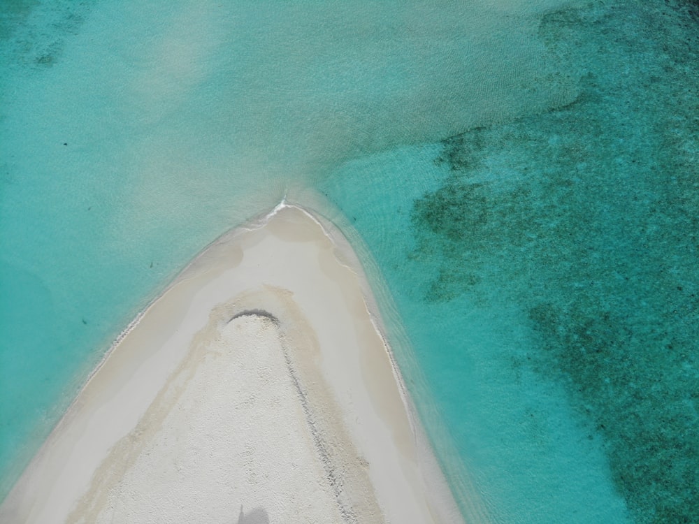 an aerial view of a boat in the water