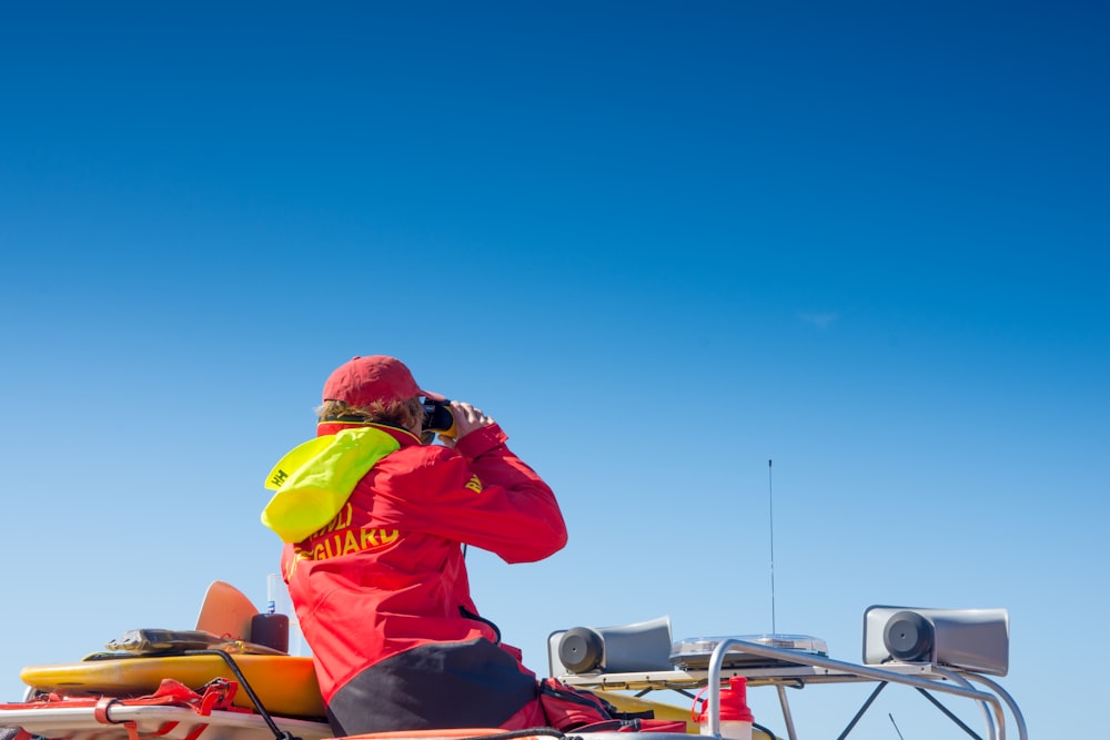 man using binoculars