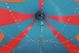 a close up of a blue and red umbrella