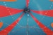 a close up of a blue and red umbrella