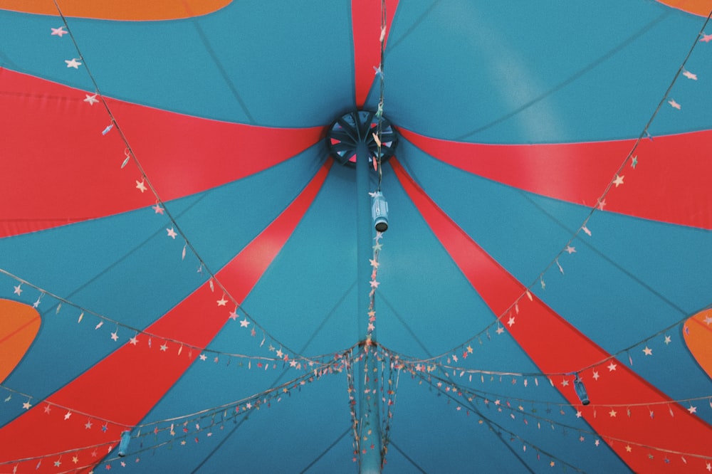 a close up of a blue and red umbrella