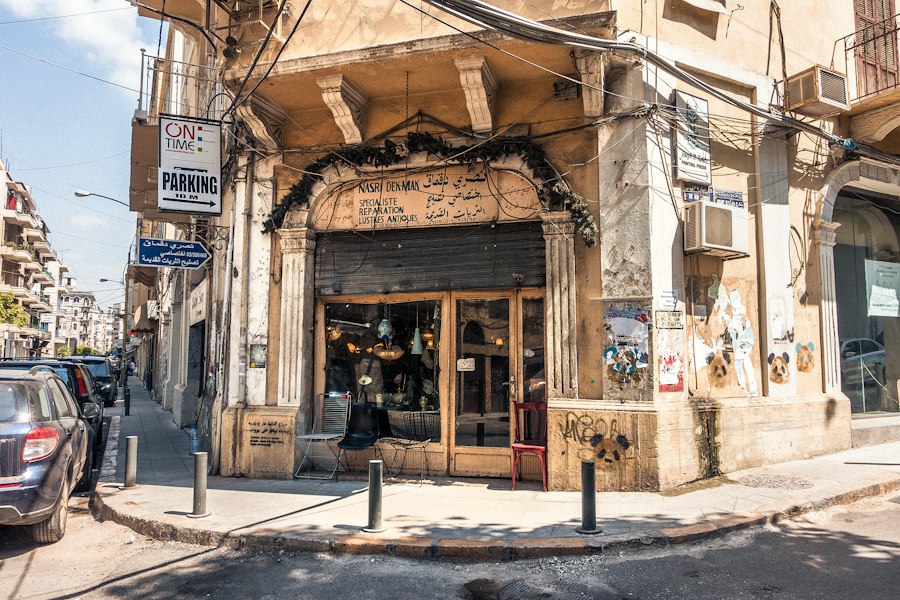 Shop fronts glowing at dusk on a Beirut street, the kind of city where Middle East women dating conversations often begin