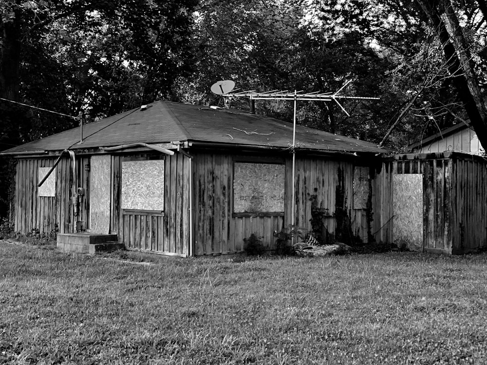 a black and white photo of a shack