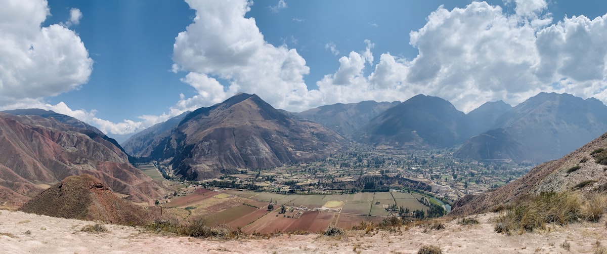 Cusco October — panoramic view over the Andean Sacred Valley from high altitude, mountains stretching to the horizon
