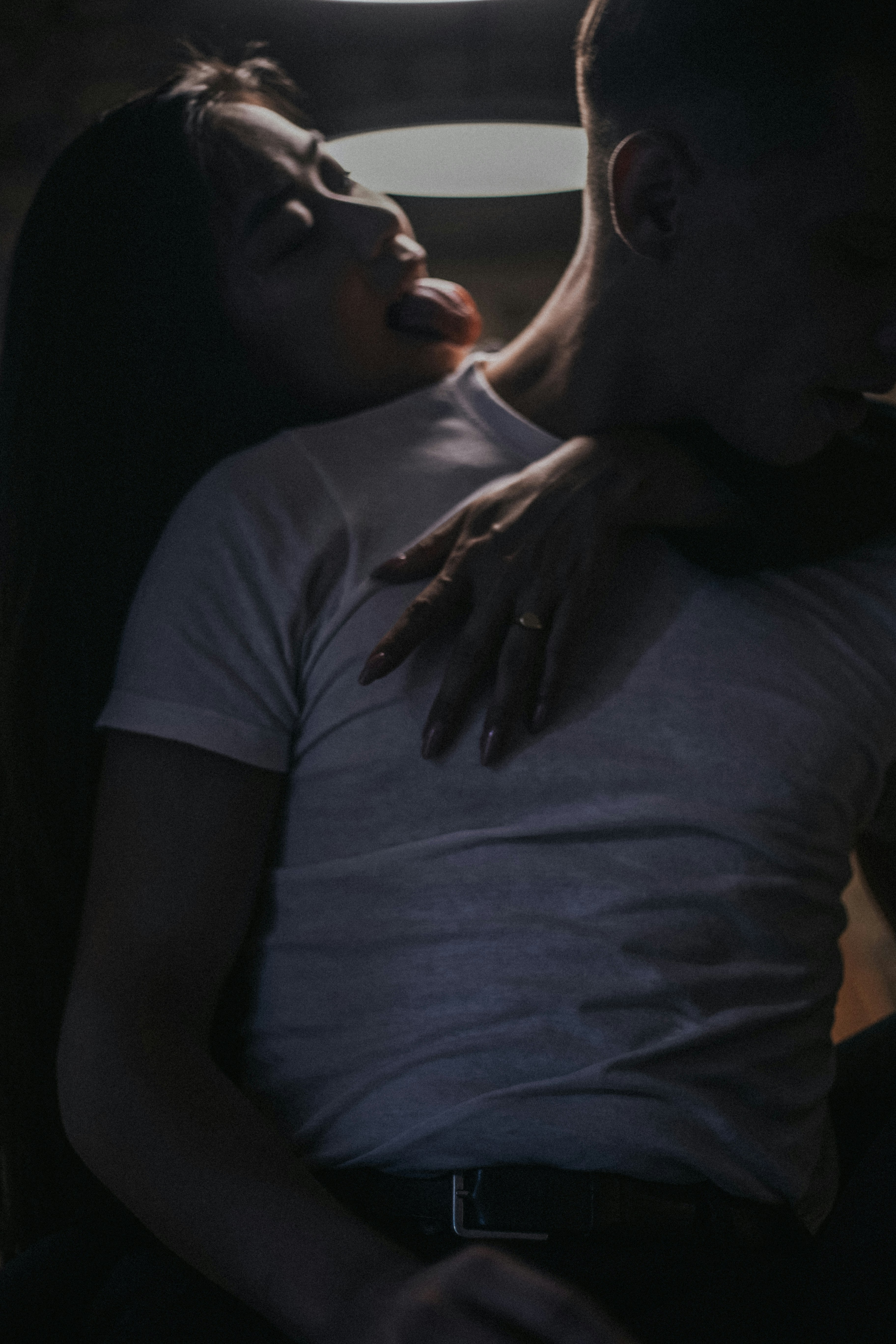 woman hugging man wearing white shirt