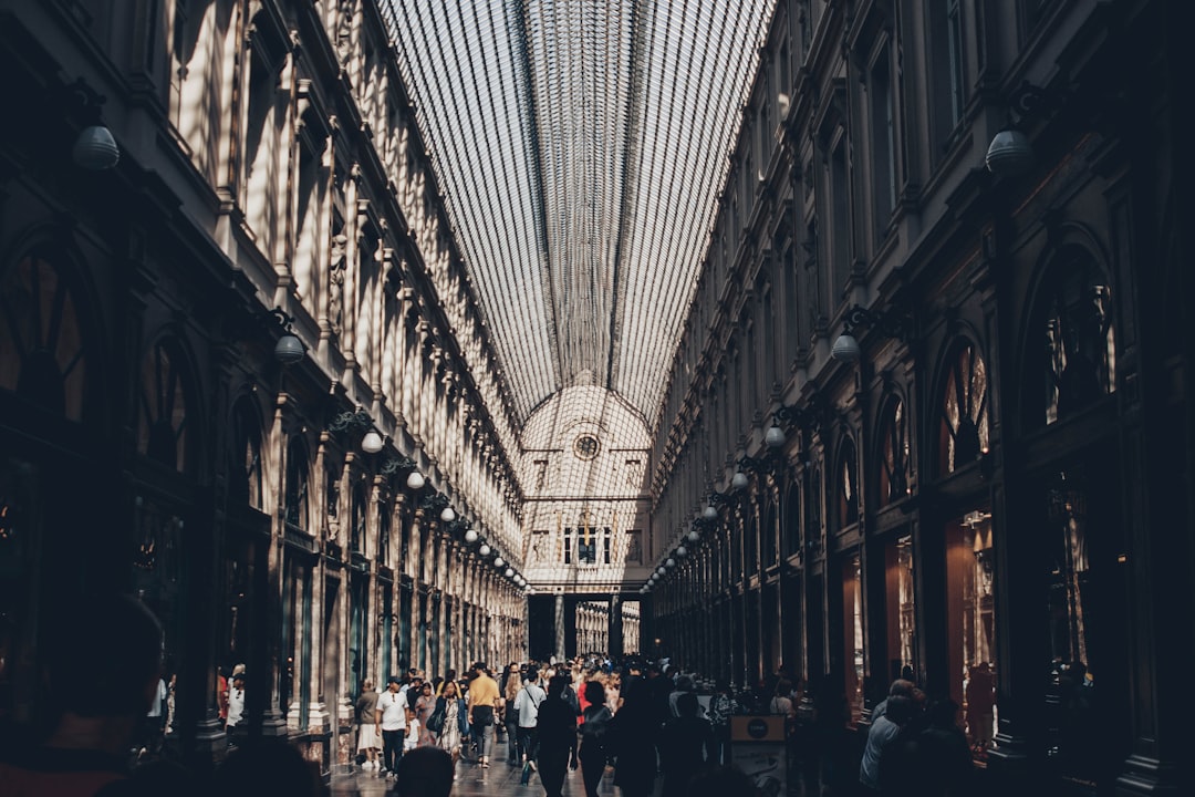 people walking beside building at daytime