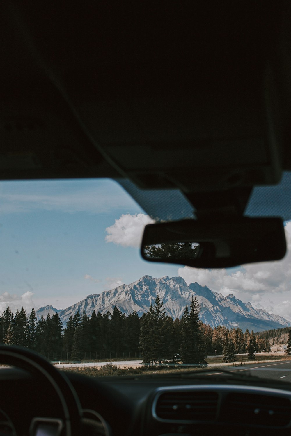 mountains from the driver view inside vehicle