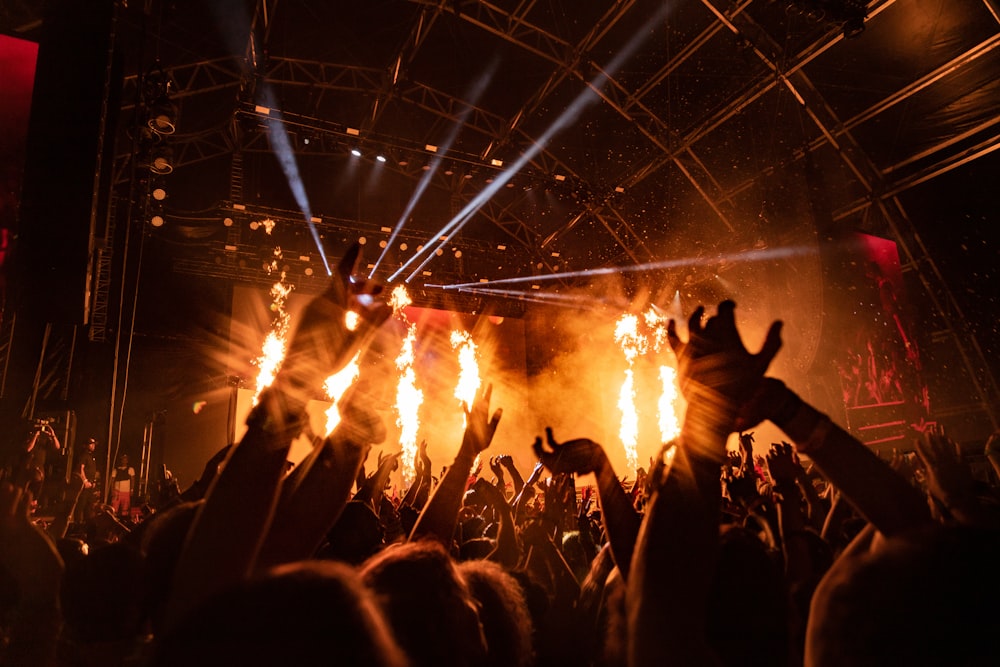 people gather near stage during nighttime