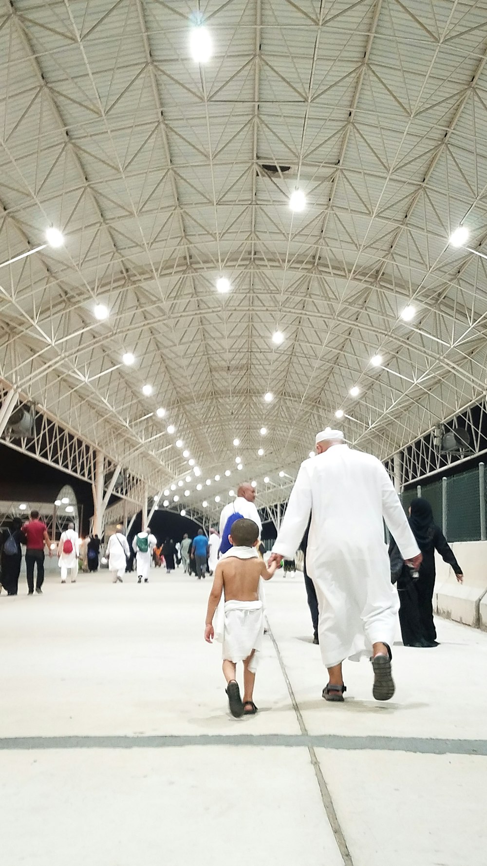 people walking at the covered court