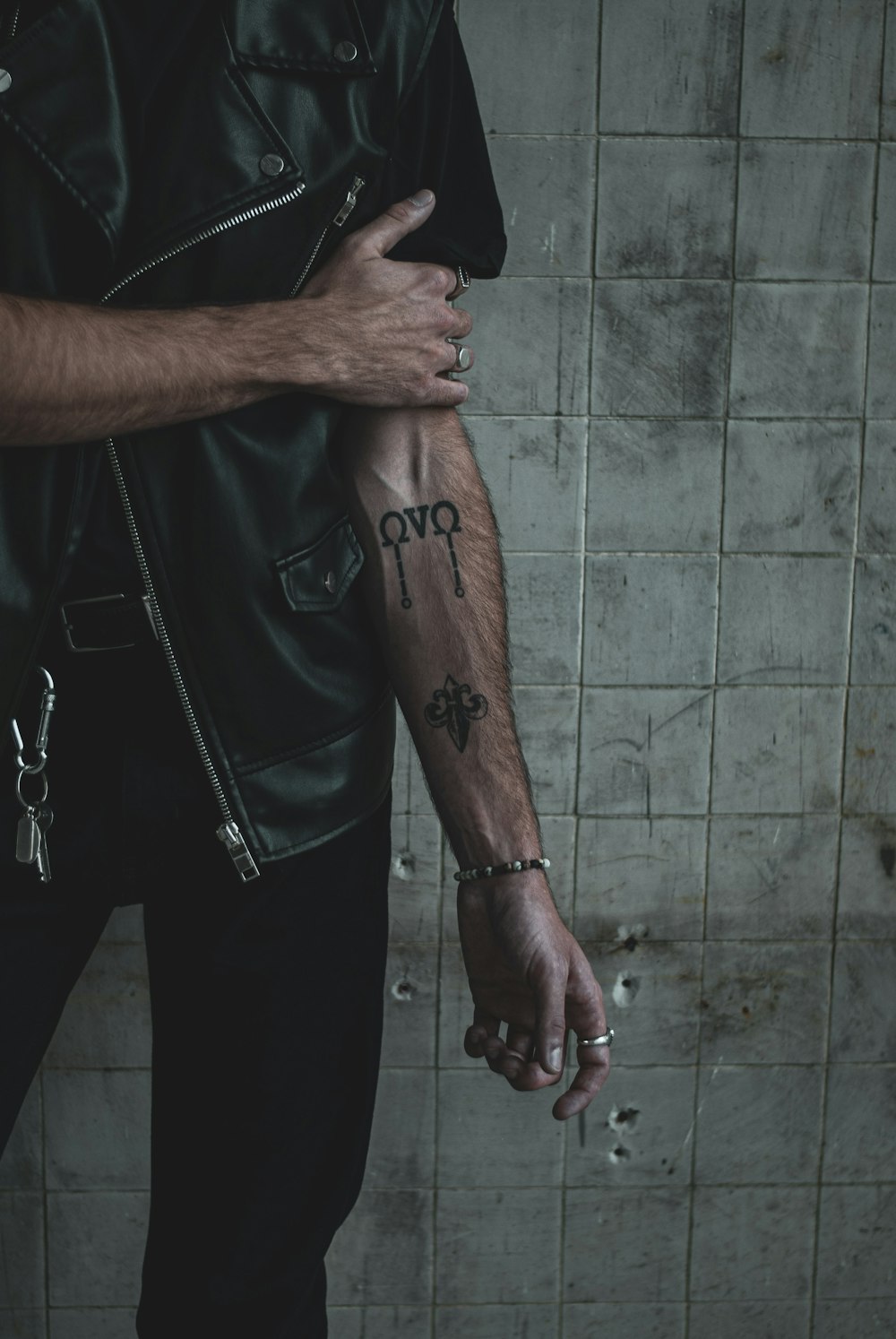 black tribal tattoo on person's left arm