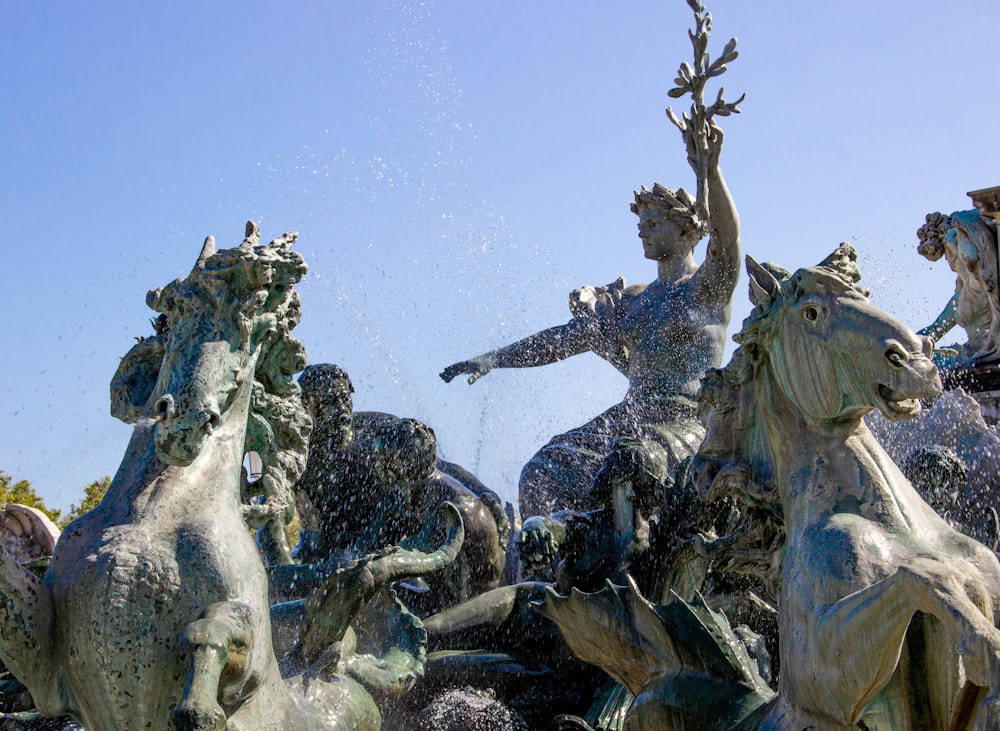 man riding on horse statue