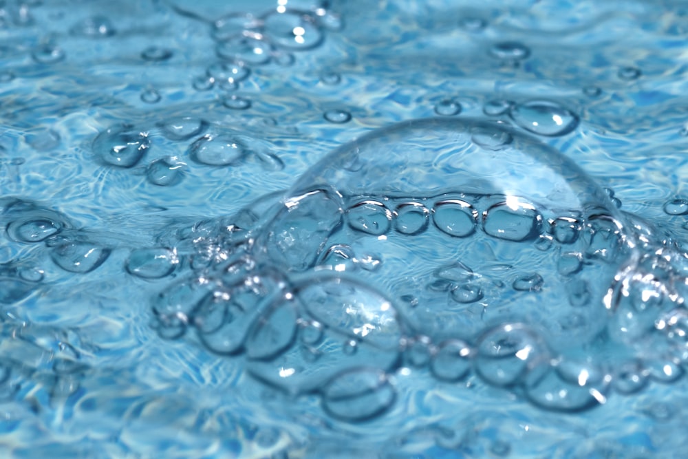 time-lapse photography of bubbles on water