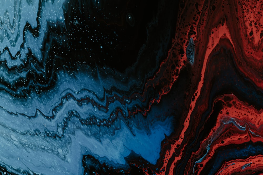 a close up of a red and blue abstract painting