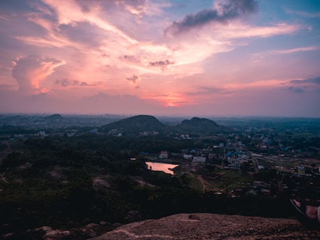 A scenic view of a dusty western town at sunset, capturing the atmosphere of Guns of Time 1865.