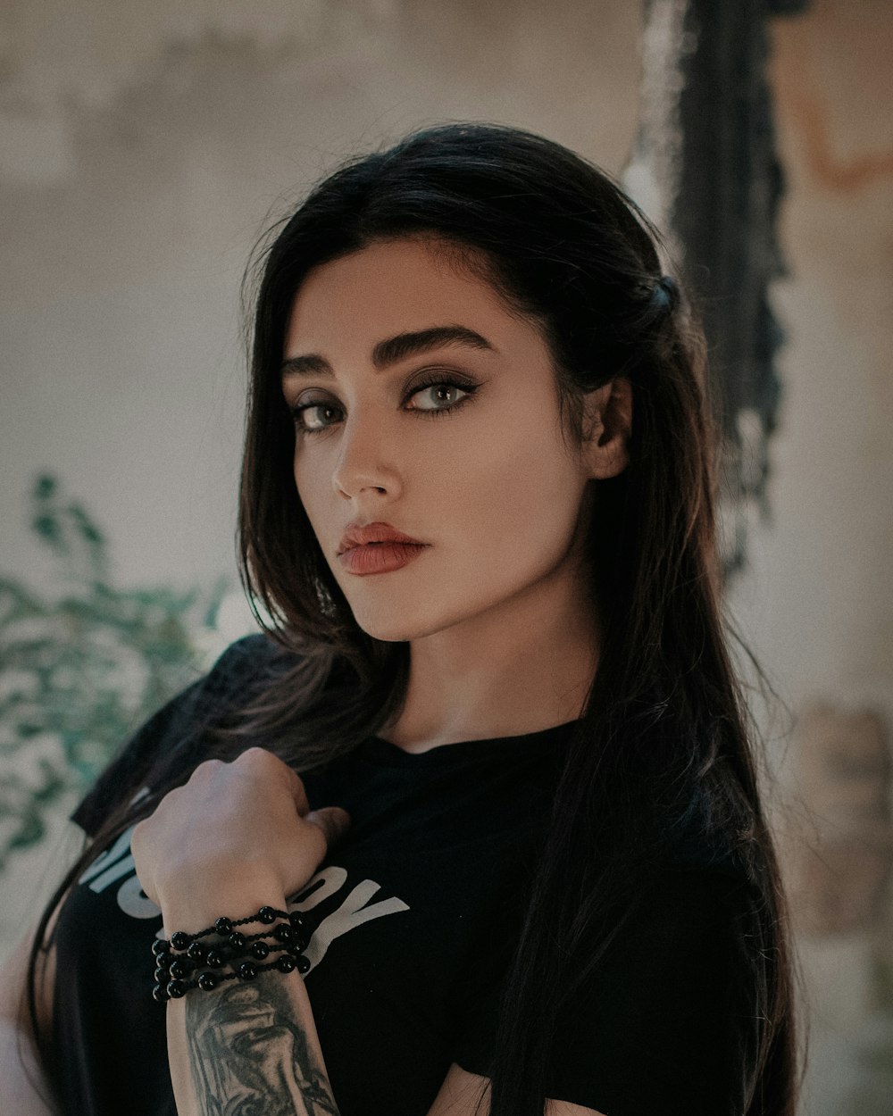 woman wearing black shirt and bracelet