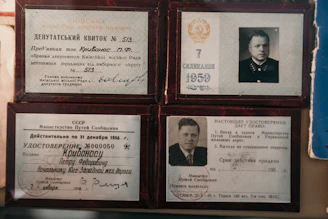 four brown wooden photo frames