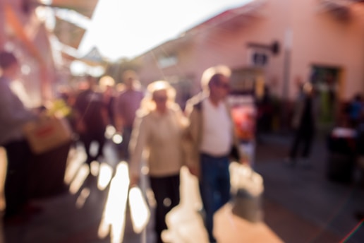 A candid shot capturing the lively street scene with natural light casting soft shadows.