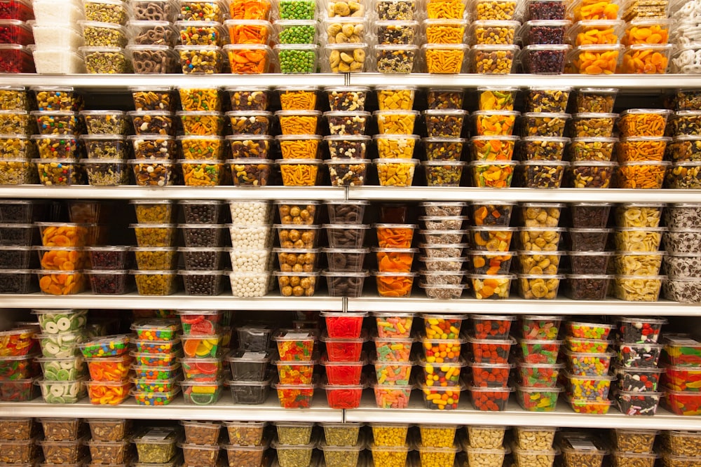 assorted containers on white shelf