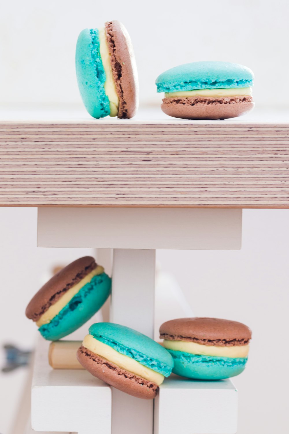 a couple of macaroons sitting on top of a table