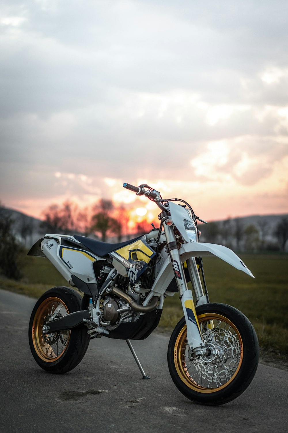 close-up photography of dirt bike parked on road