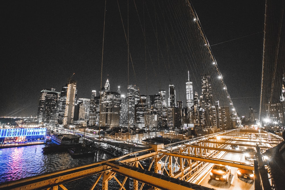 a view of a city at night from a bridge