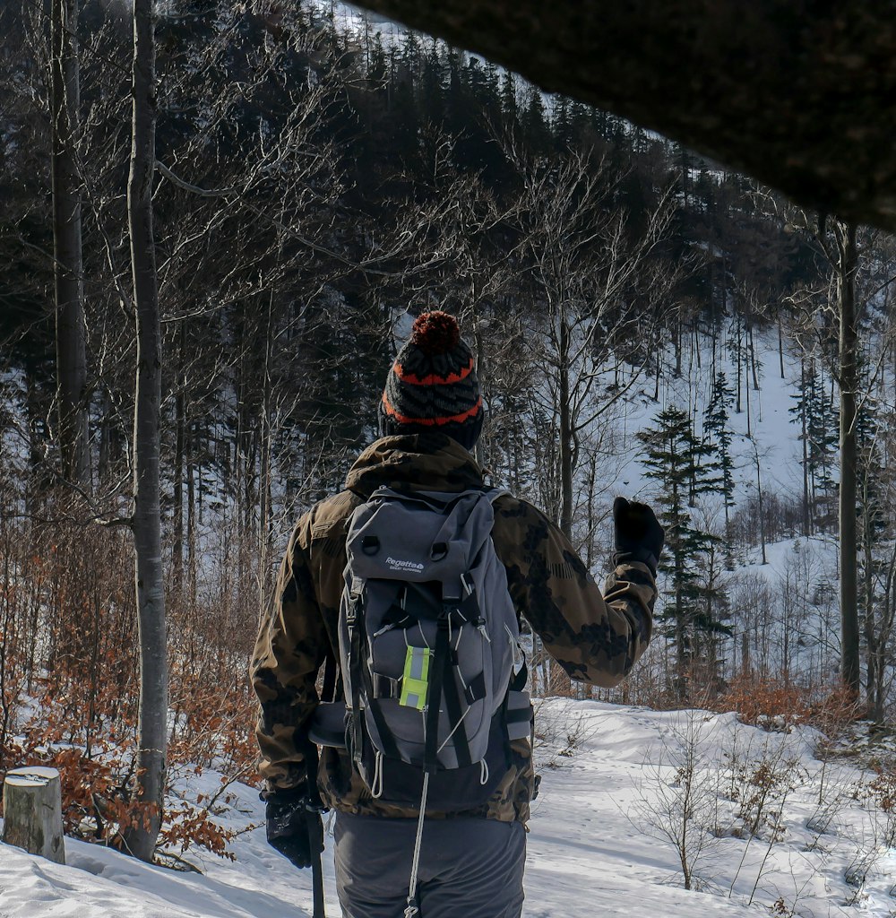 person wearing jacket and carrier