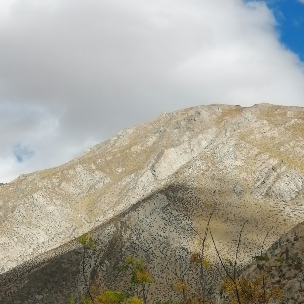 a view of a mountain with a sky in the background