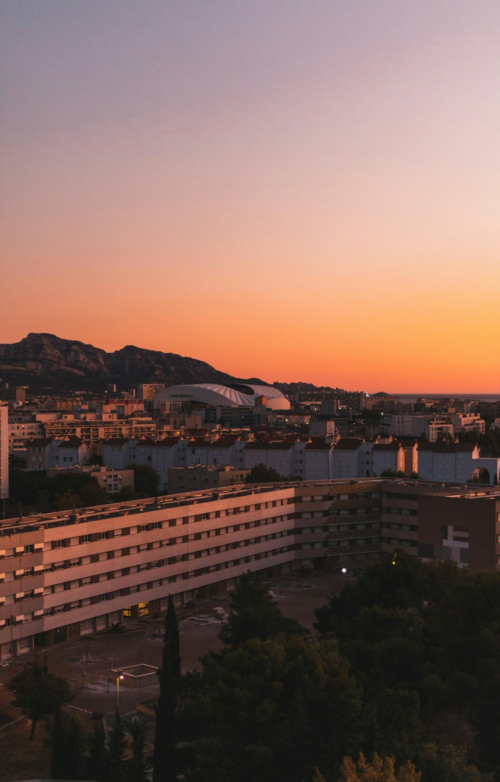 gray concrete buildings during golden hour