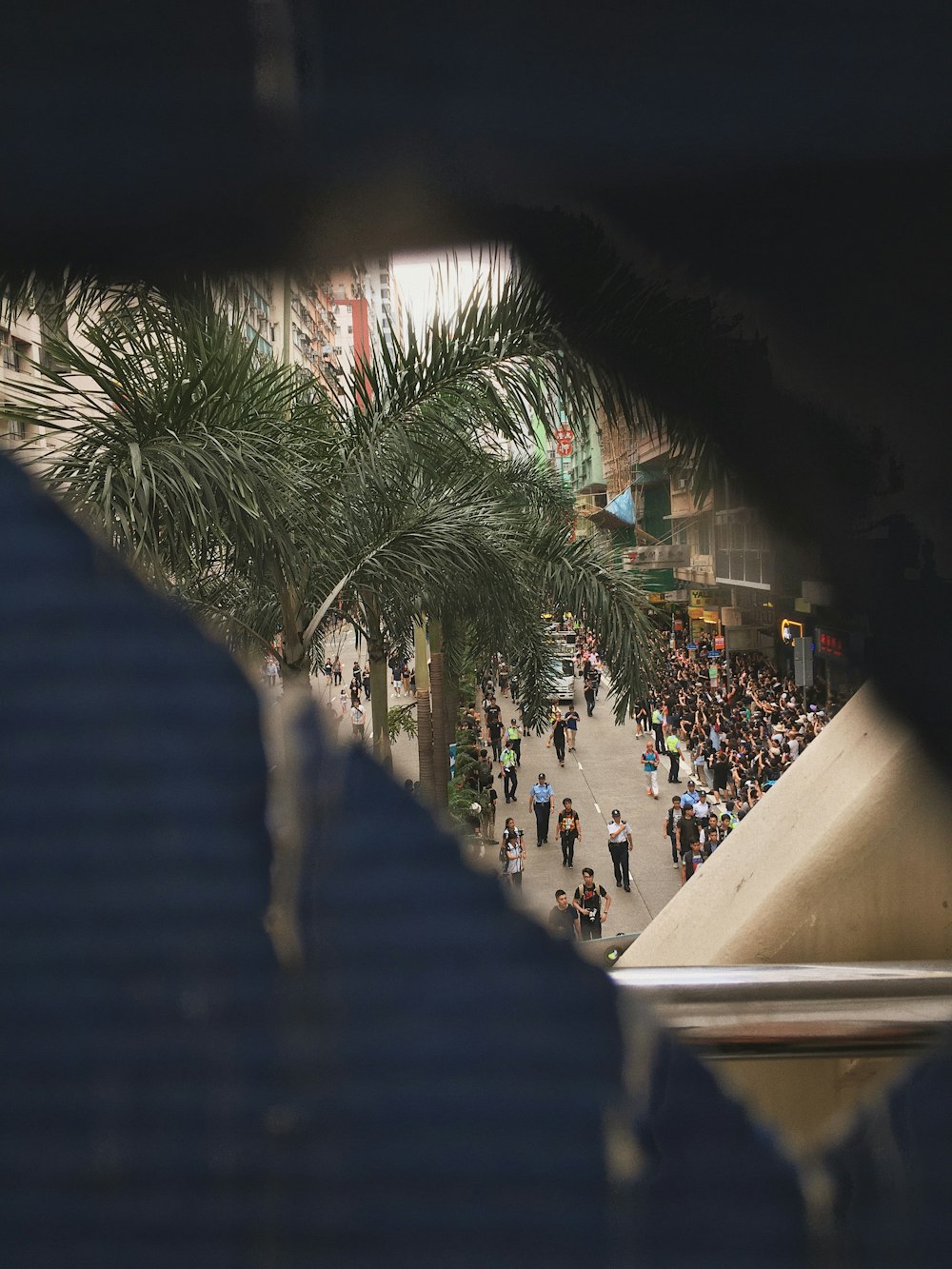 people walking near road beside buildings during daytime