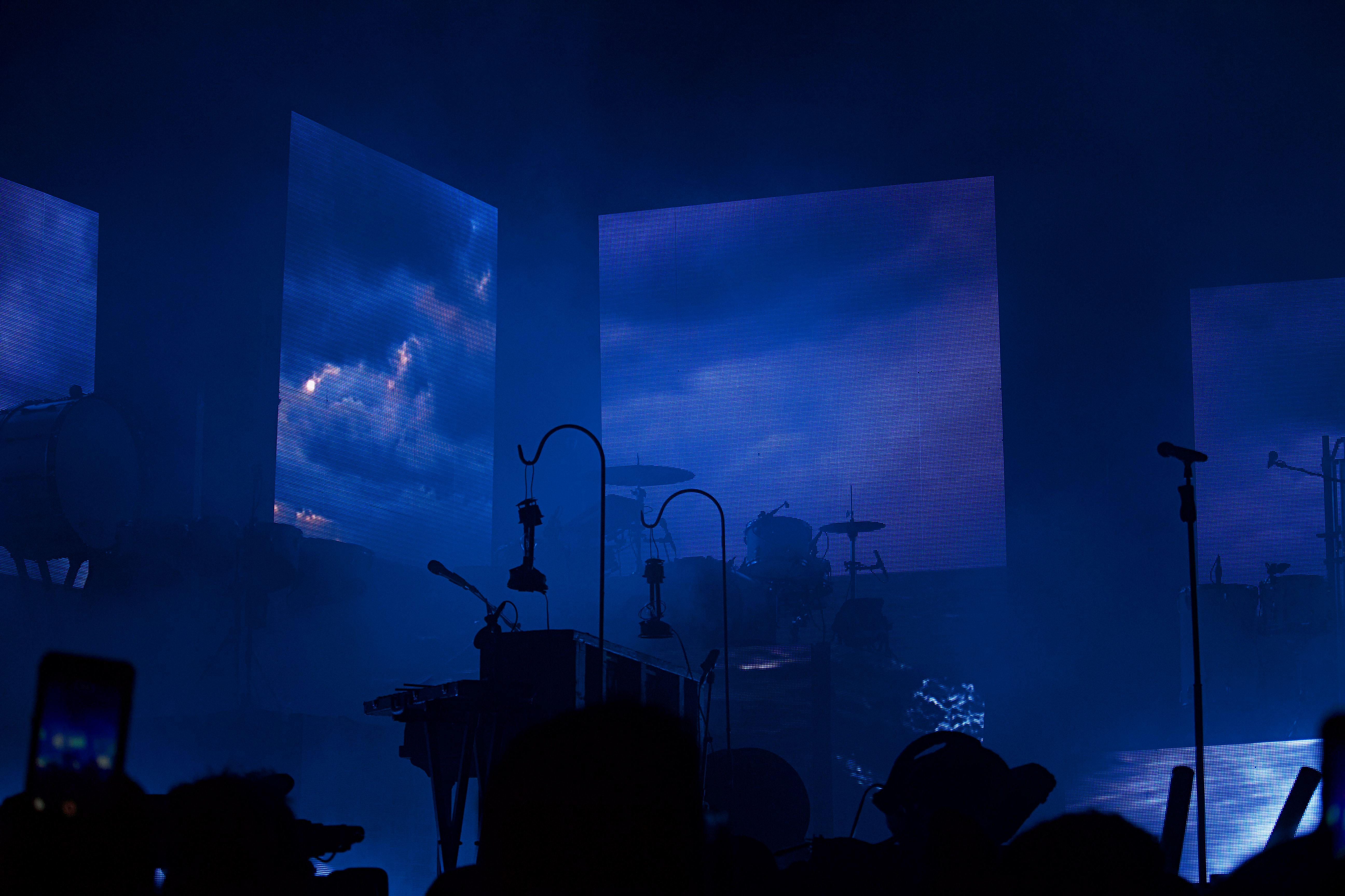 a group of people that are standing in front of a stage
