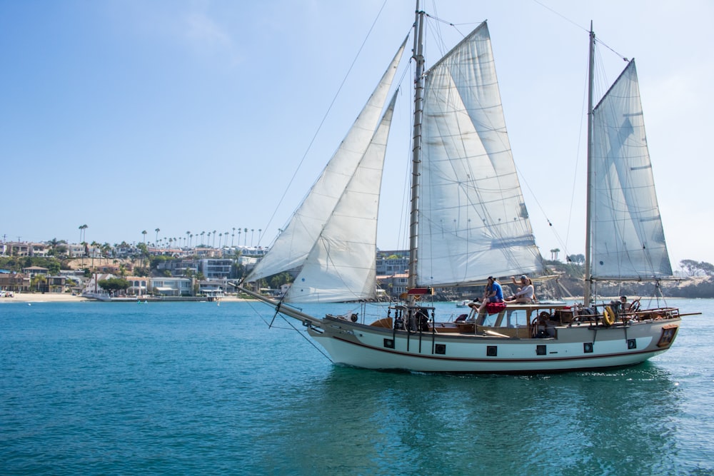 sailboat on water under clear sky