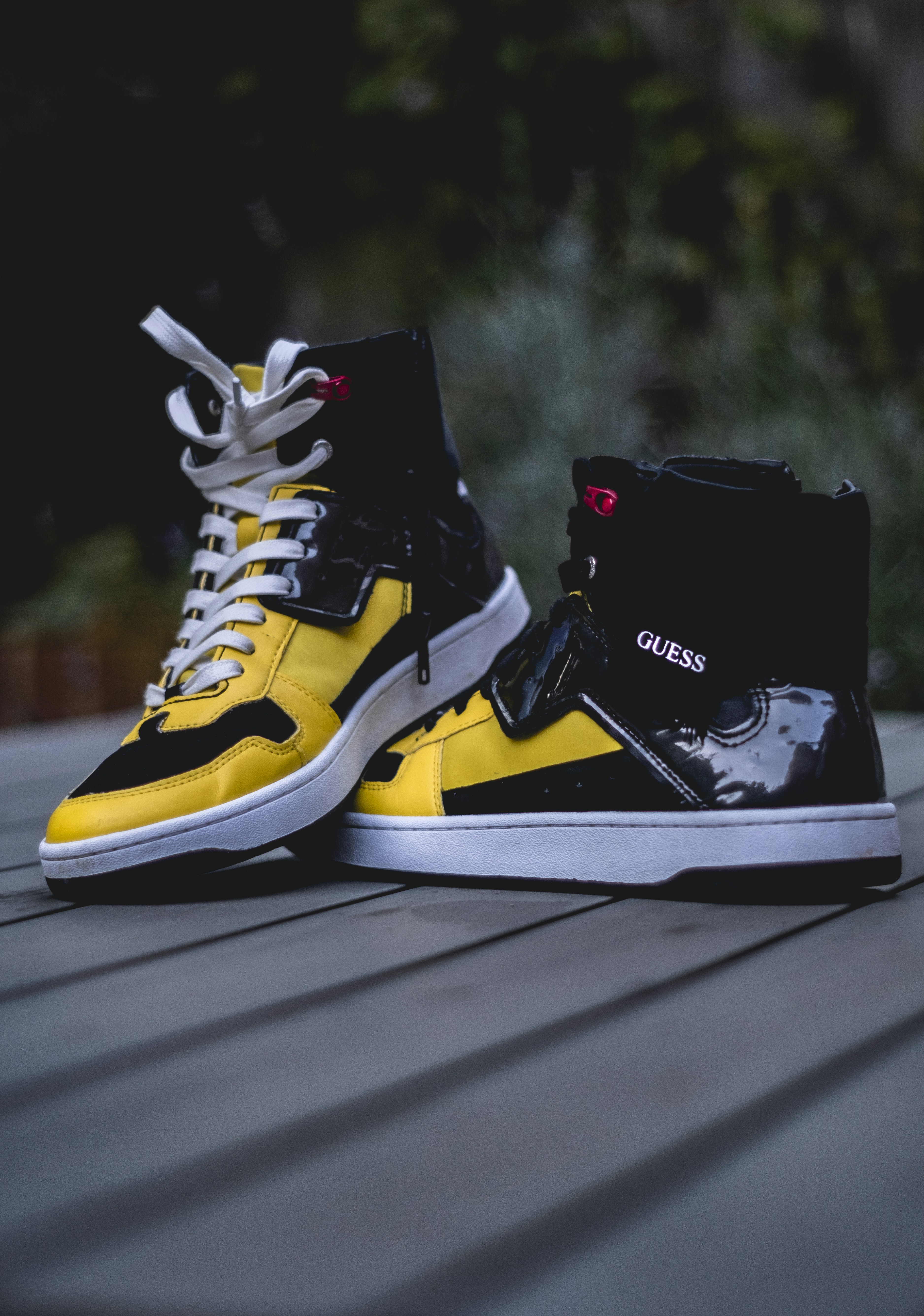 black and yellow high tops