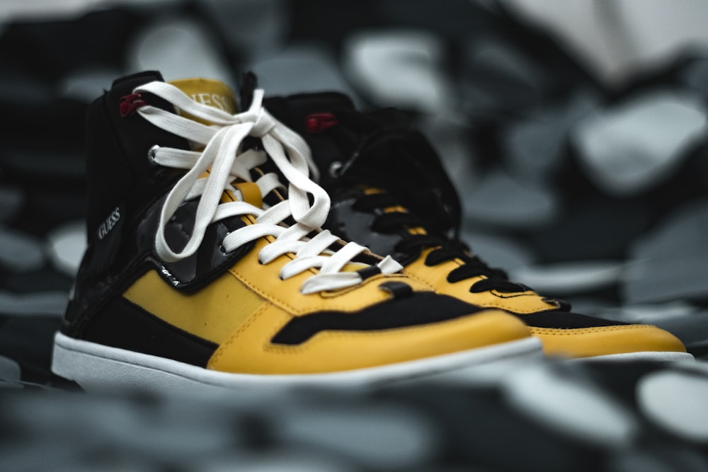 macro photography of yellow-and-black high-top shoes