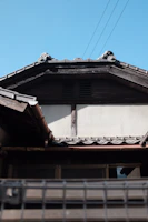 Wide shot of a traditional house with a newly repaired zinc roof.