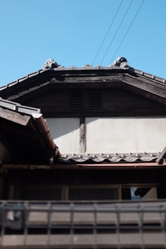 Photo of a traditional wooden roof frame freshly installed on a residential house.